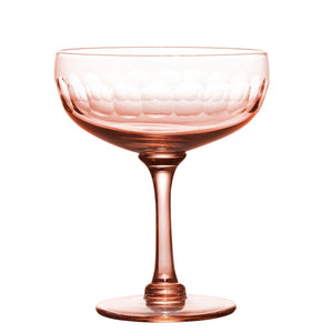A set of four rose cocktail glasses with lens design