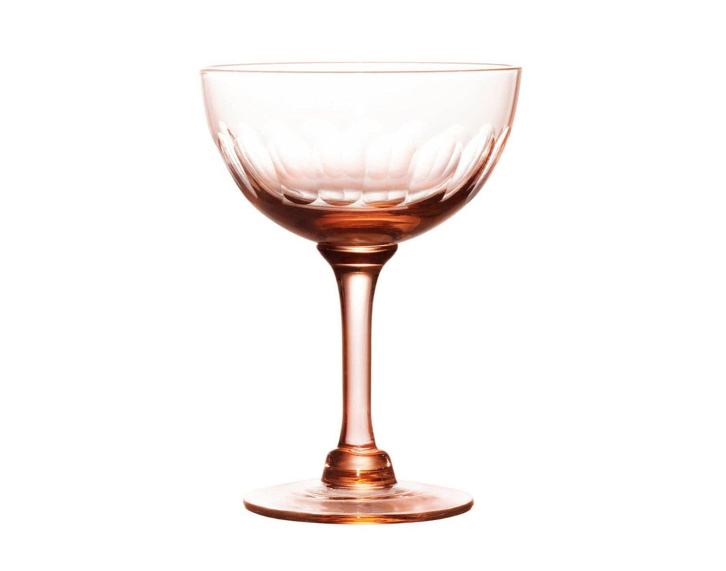 A set of four rose champagne saucers with lens design